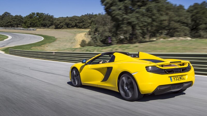 Yellow McLaren on a racetrack