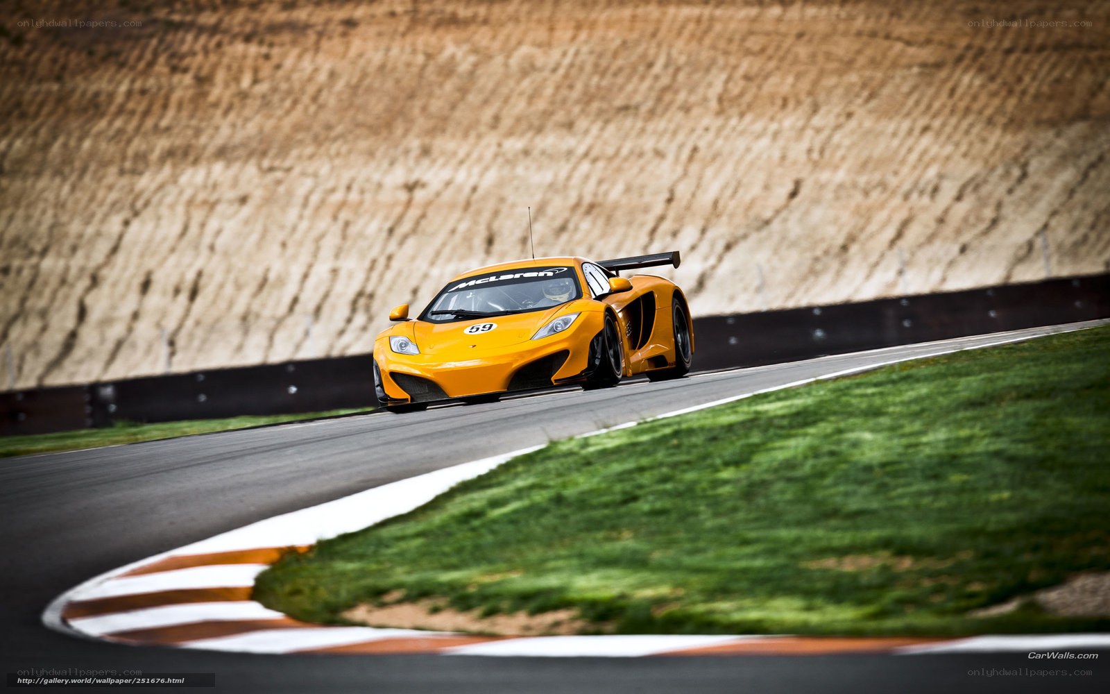 Yellow McLaren on a racetrack