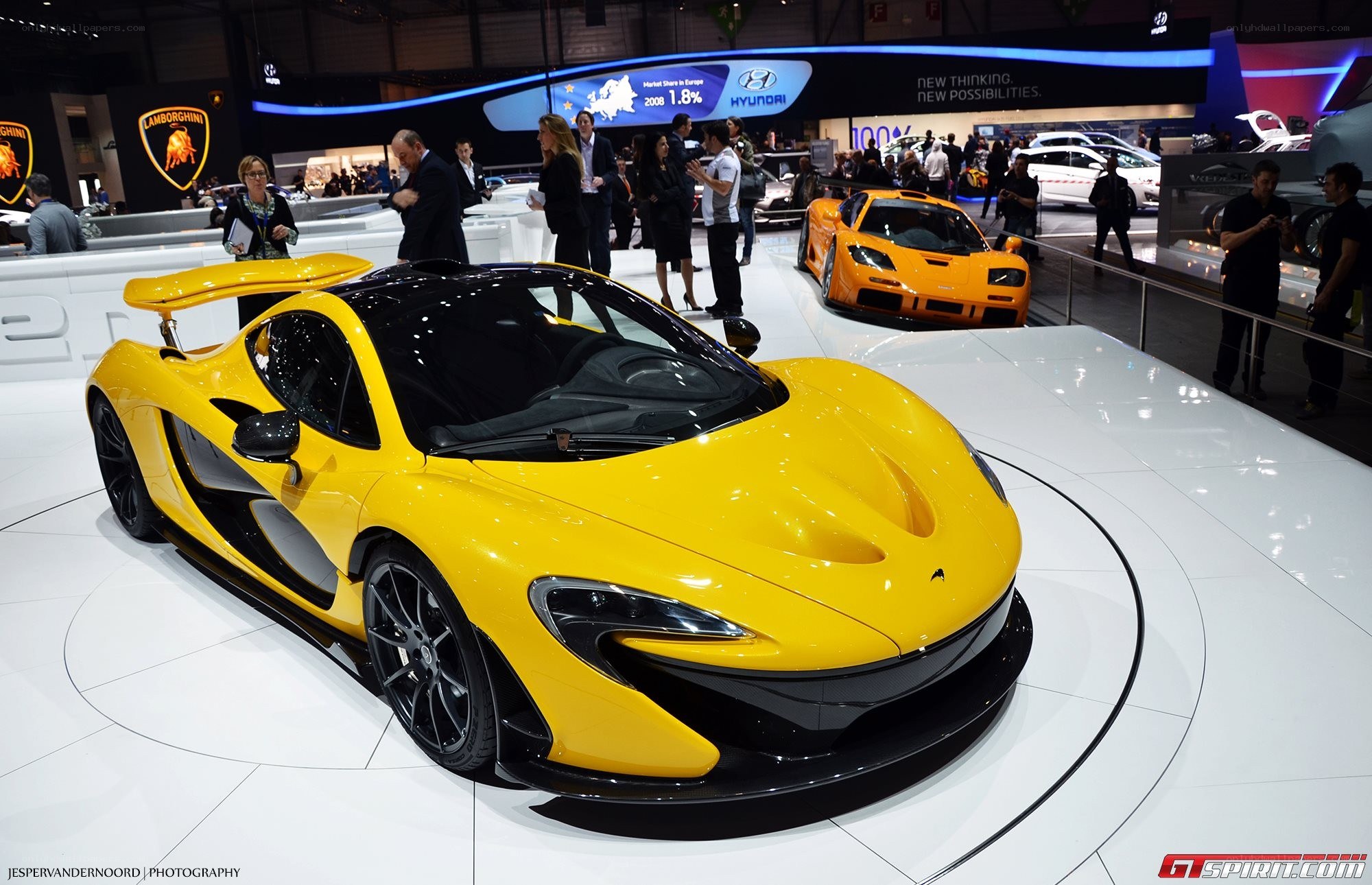 Yellow McLaren P1 at auto show