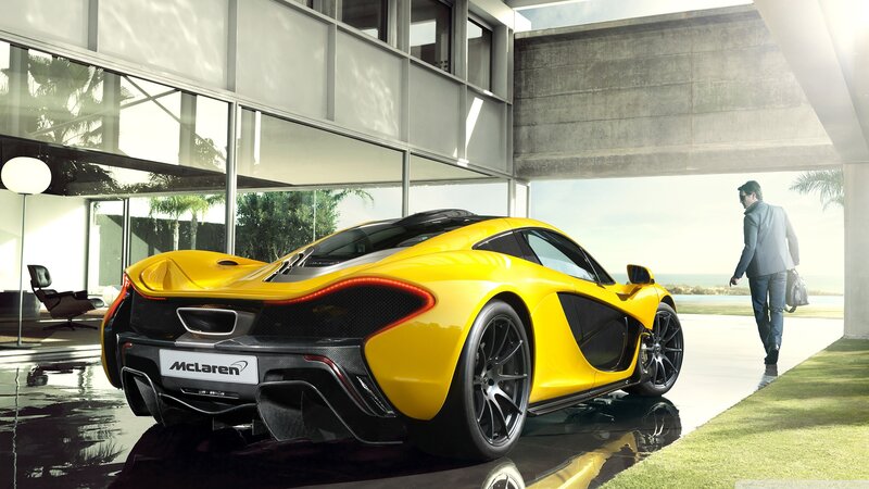 Yellow McLaren P1 in modern garage