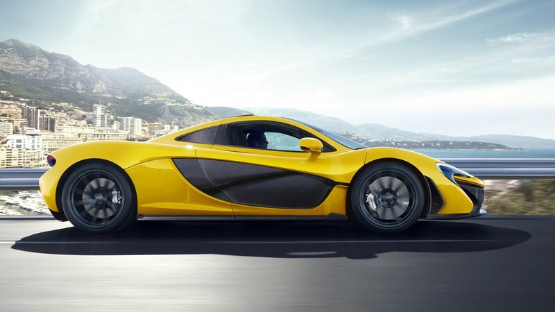Yellow McLaren P1 on coastal road