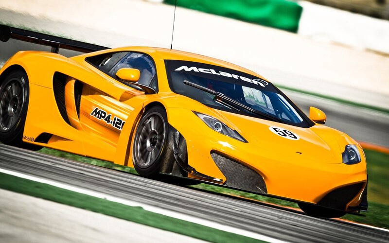 Yellow McLaren race car on track