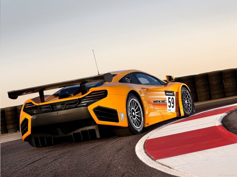 Yellow McLaren race car on track