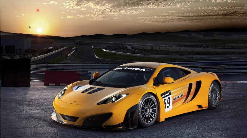 Yellow McLaren race car on track