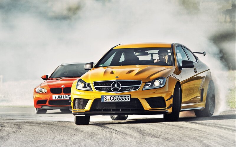 Yellow Mercedes and red BMW racing