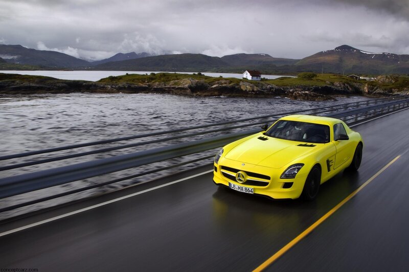 Yellow Mercedes-Benz SLS AMG on a coastal road