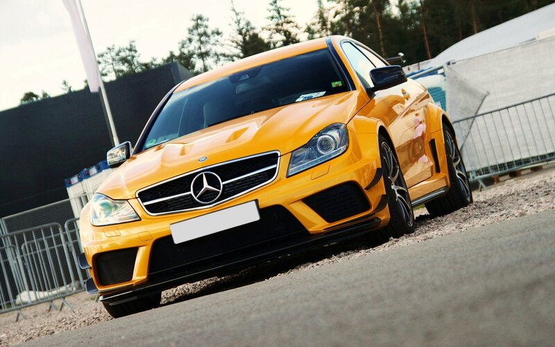 yellow mercedes-benz sports car