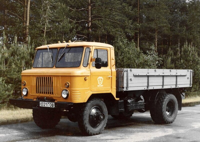 Yellow military truck in forest