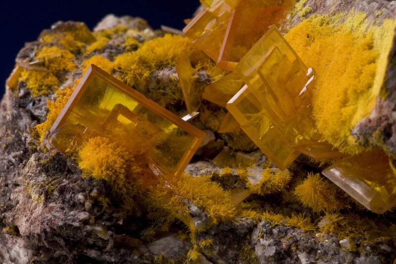 Yellow mineral crystals on rock