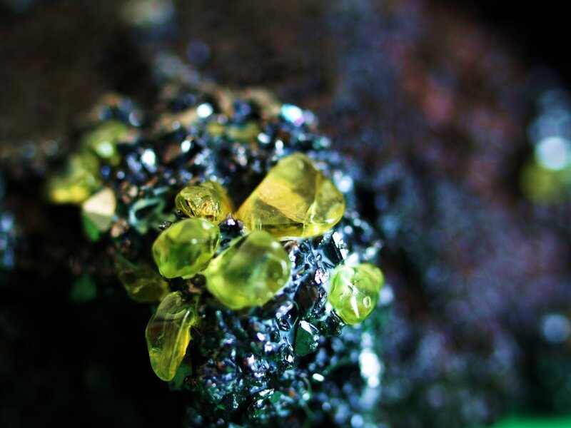 Yellow mineral crystals on rock