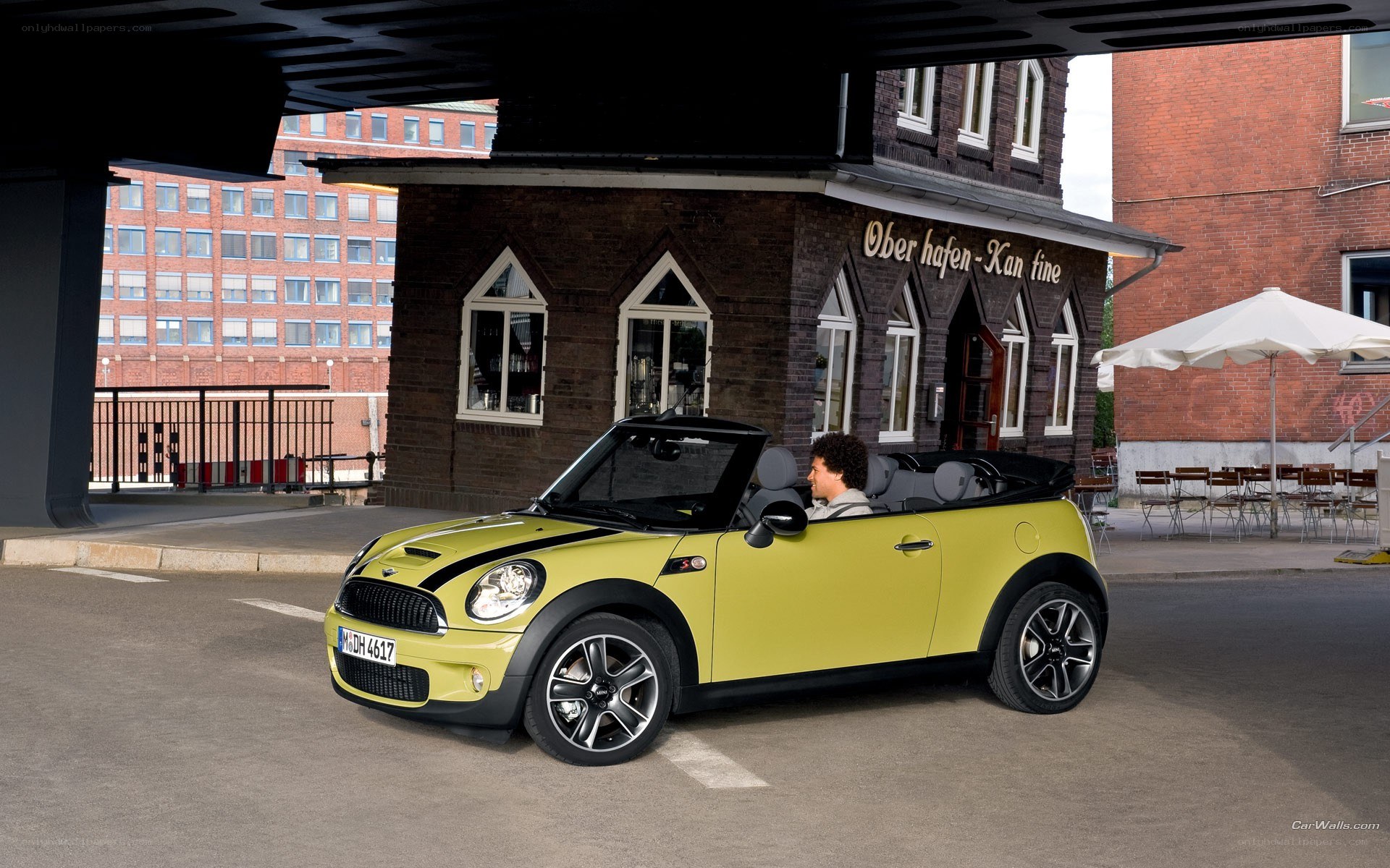 Yellow MINI convertible in city