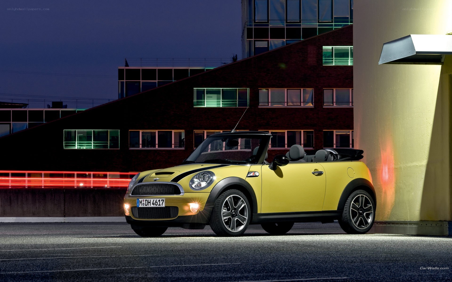 Yellow MINI Cooper parked at night