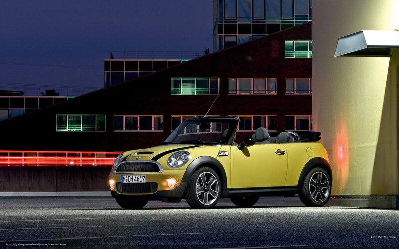 Yellow MINI Cooper parked at night
