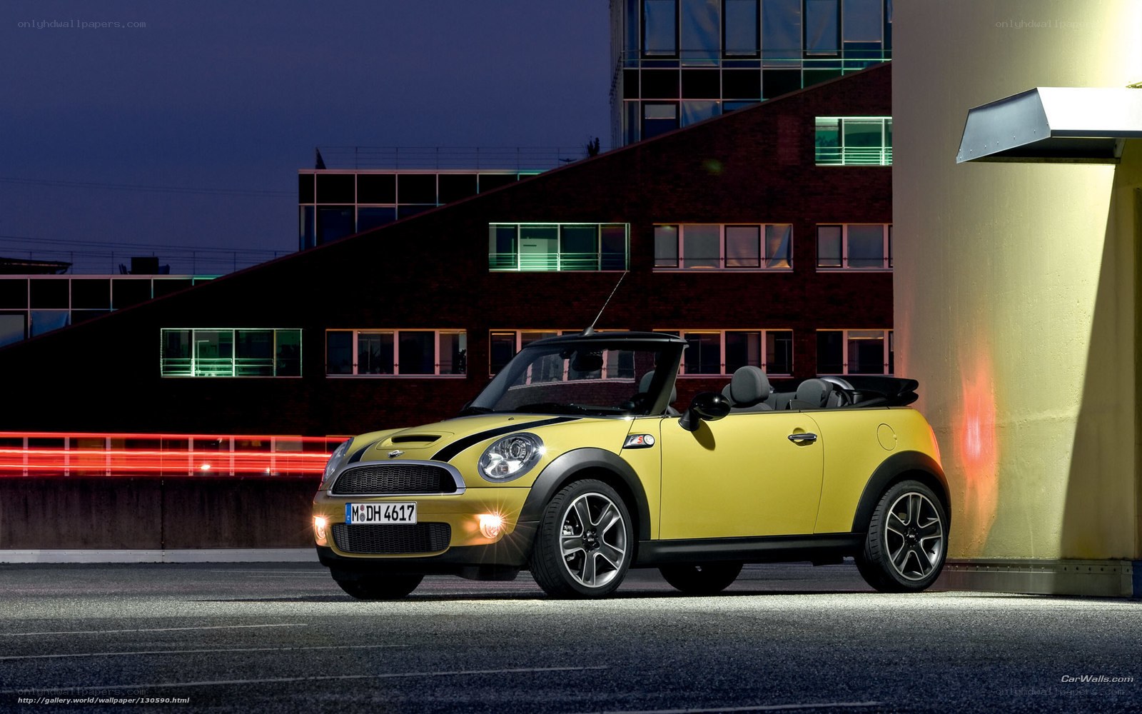 Yellow MINI Cooper parked at night