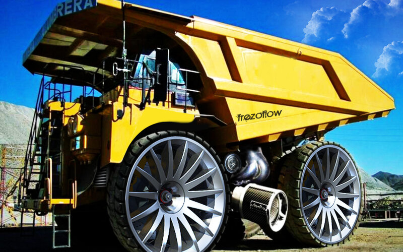 Yellow mining truck with custom wheels