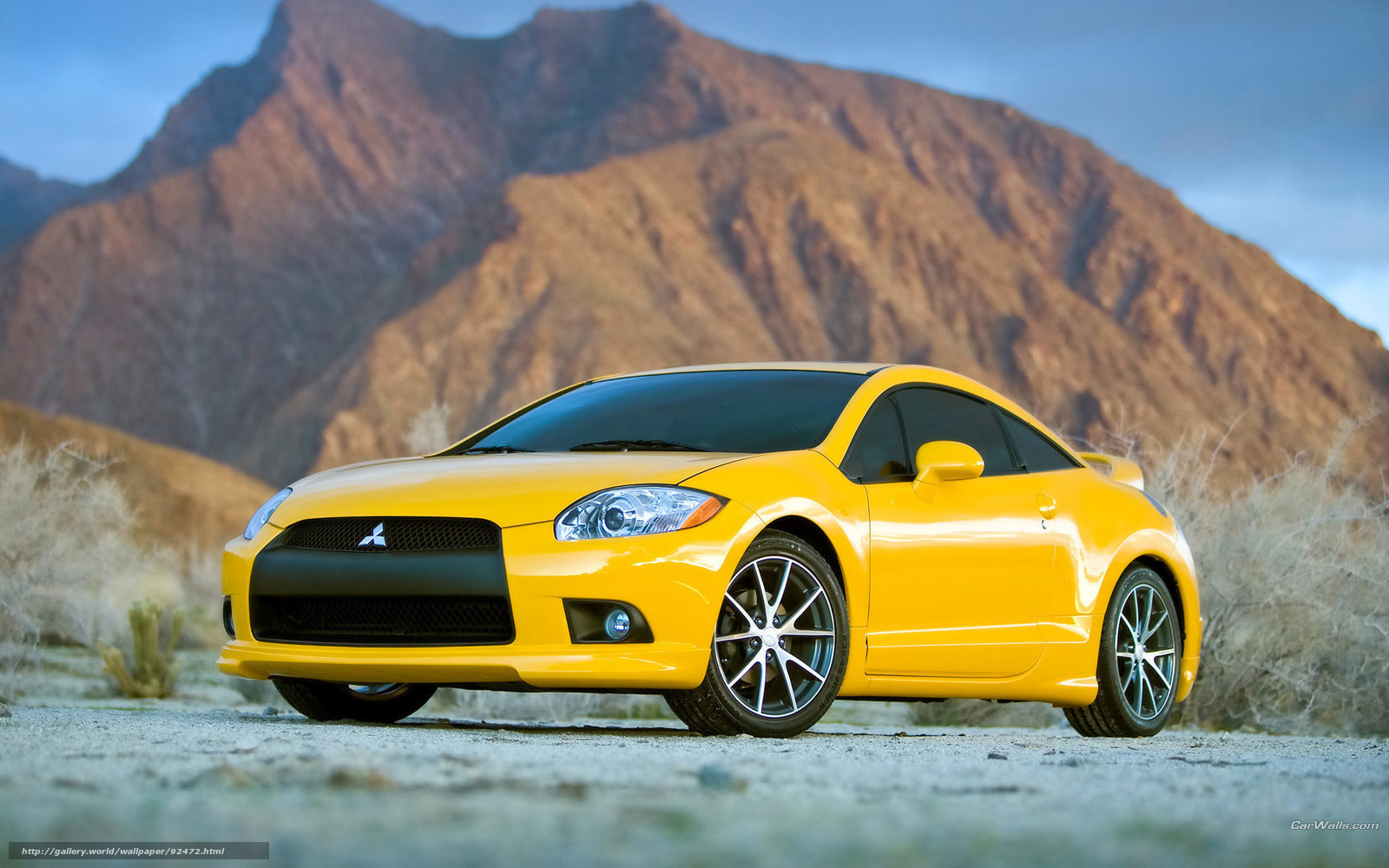 Yellow Mitsubishi Eclipse in desert