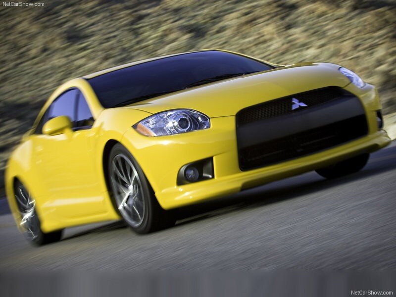 yellow mitsubishi eclipse in motion