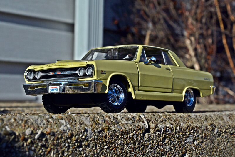 Yellow Model Car — Dramatic, Afternoon, Photograph, Concrete Wall