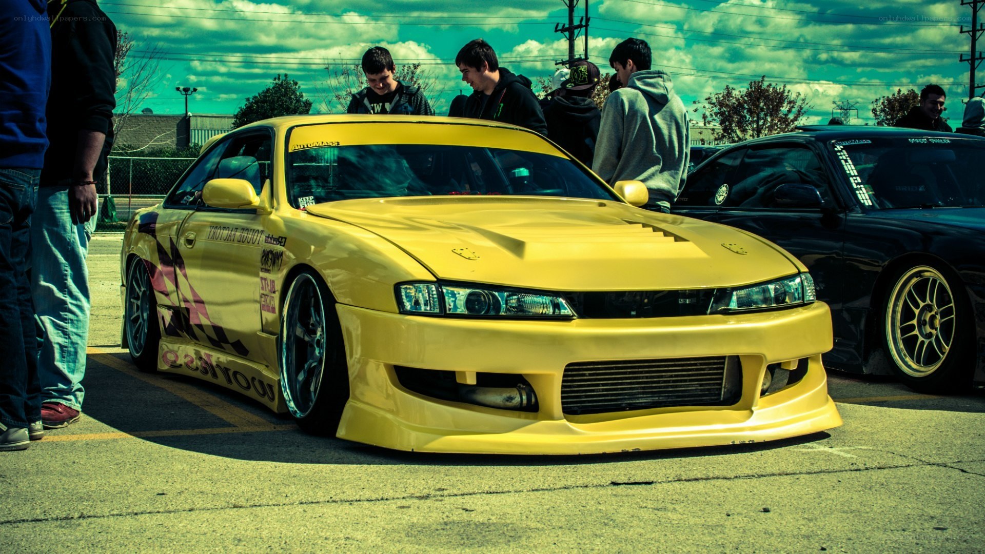 Yellow modified car at a meet