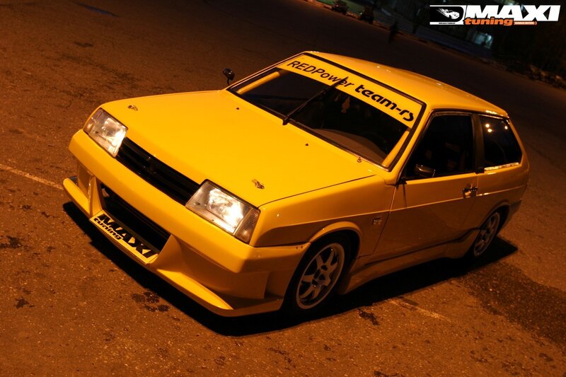 yellow modified car at night