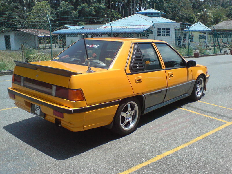 yellow modified sedan car