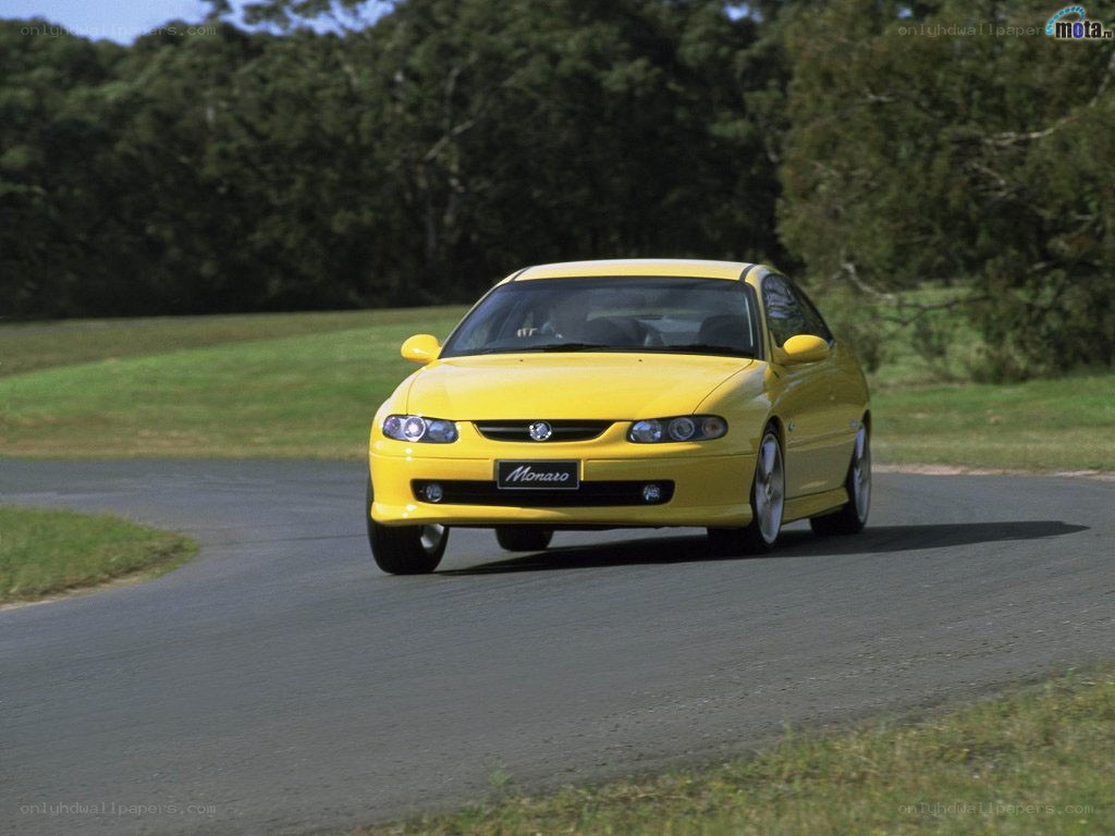 Yellow Monaro on a road