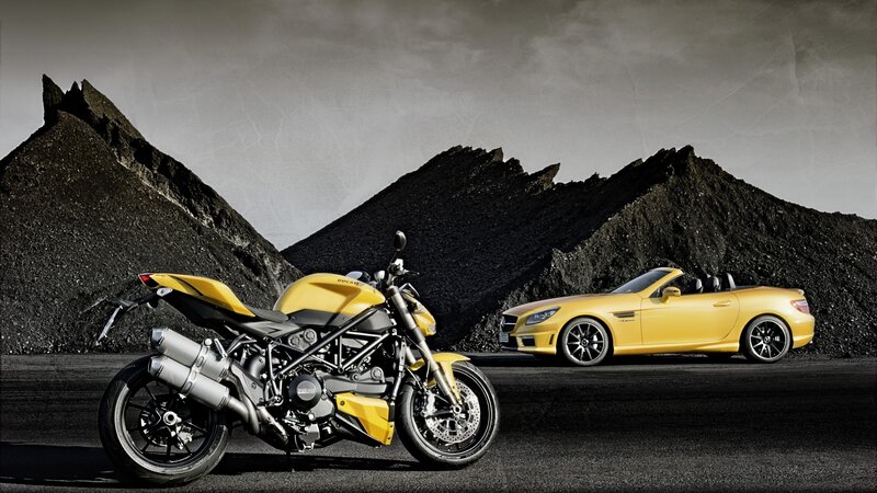 Yellow motorcycle and car