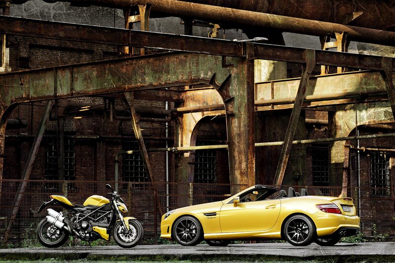 Yellow Motorcycle and Car — Dramatic, Photograph, Industrial Building