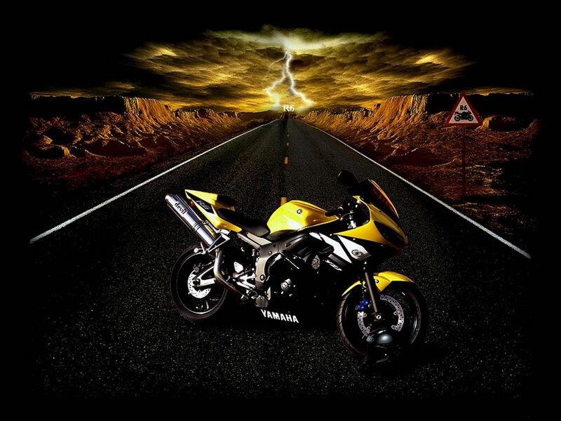 Yellow motorcycle on a stormy road