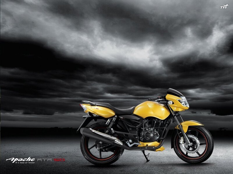 Yellow motorcycle on dark road