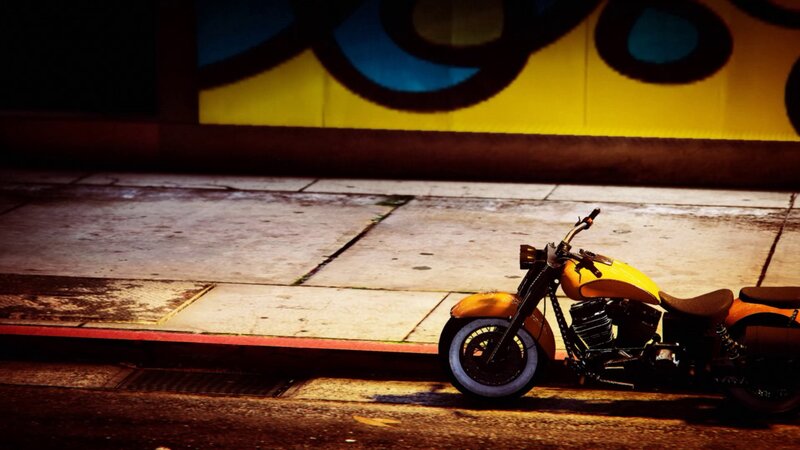Yellow Motorcycle on Sidewalk