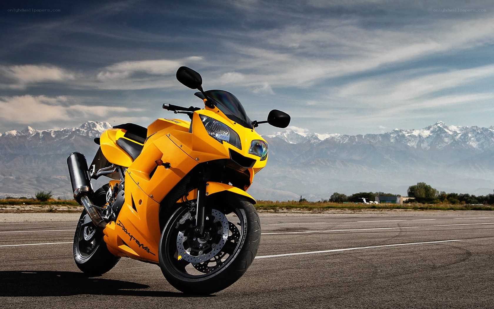 Yellow motorcycle on tarmac