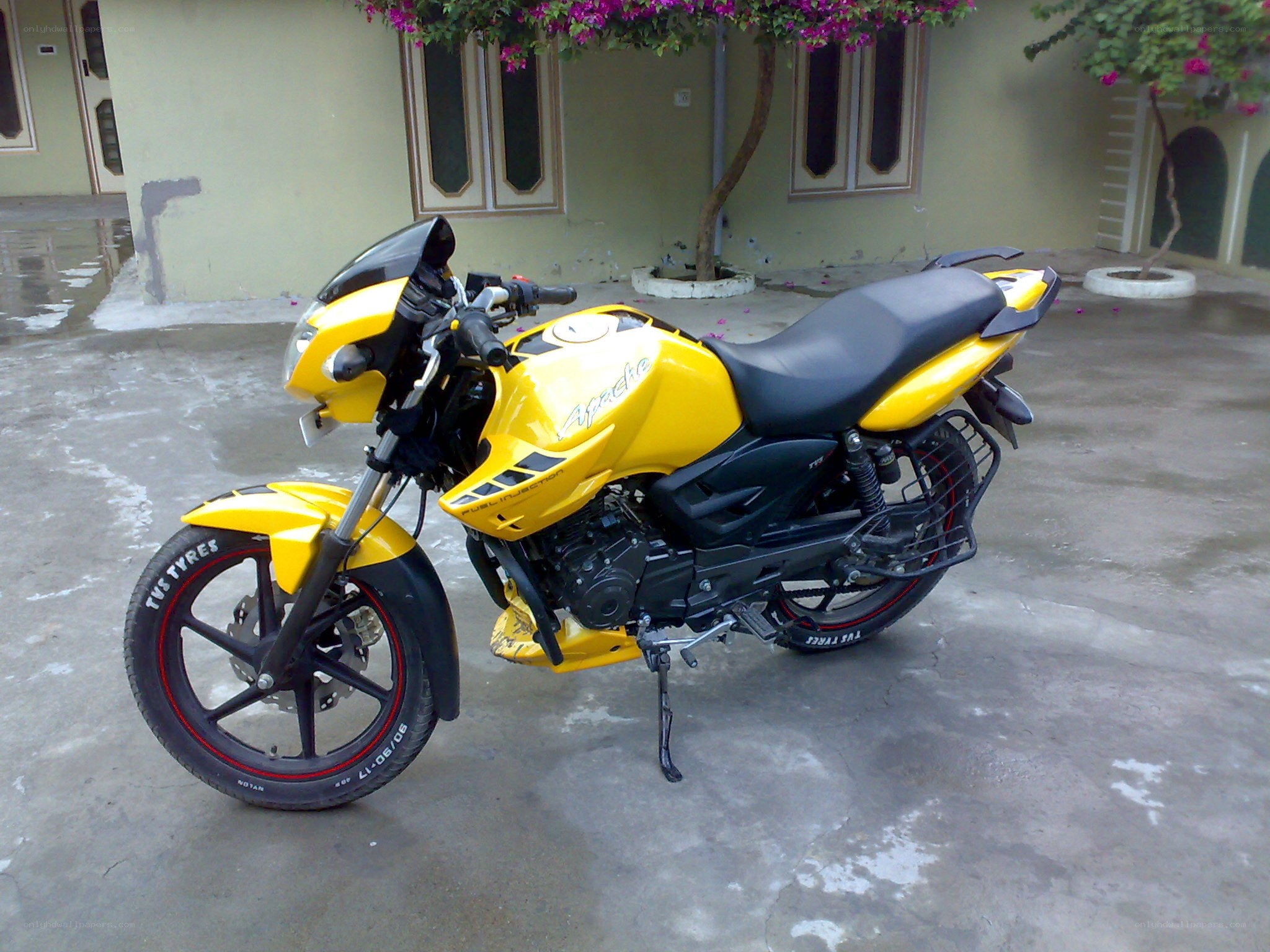 yellow motorcycle parked outside