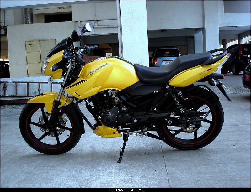 yellow motorcycle parked