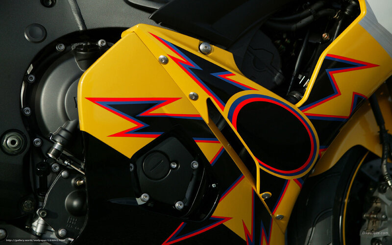 yellow motorcycle with lightning design