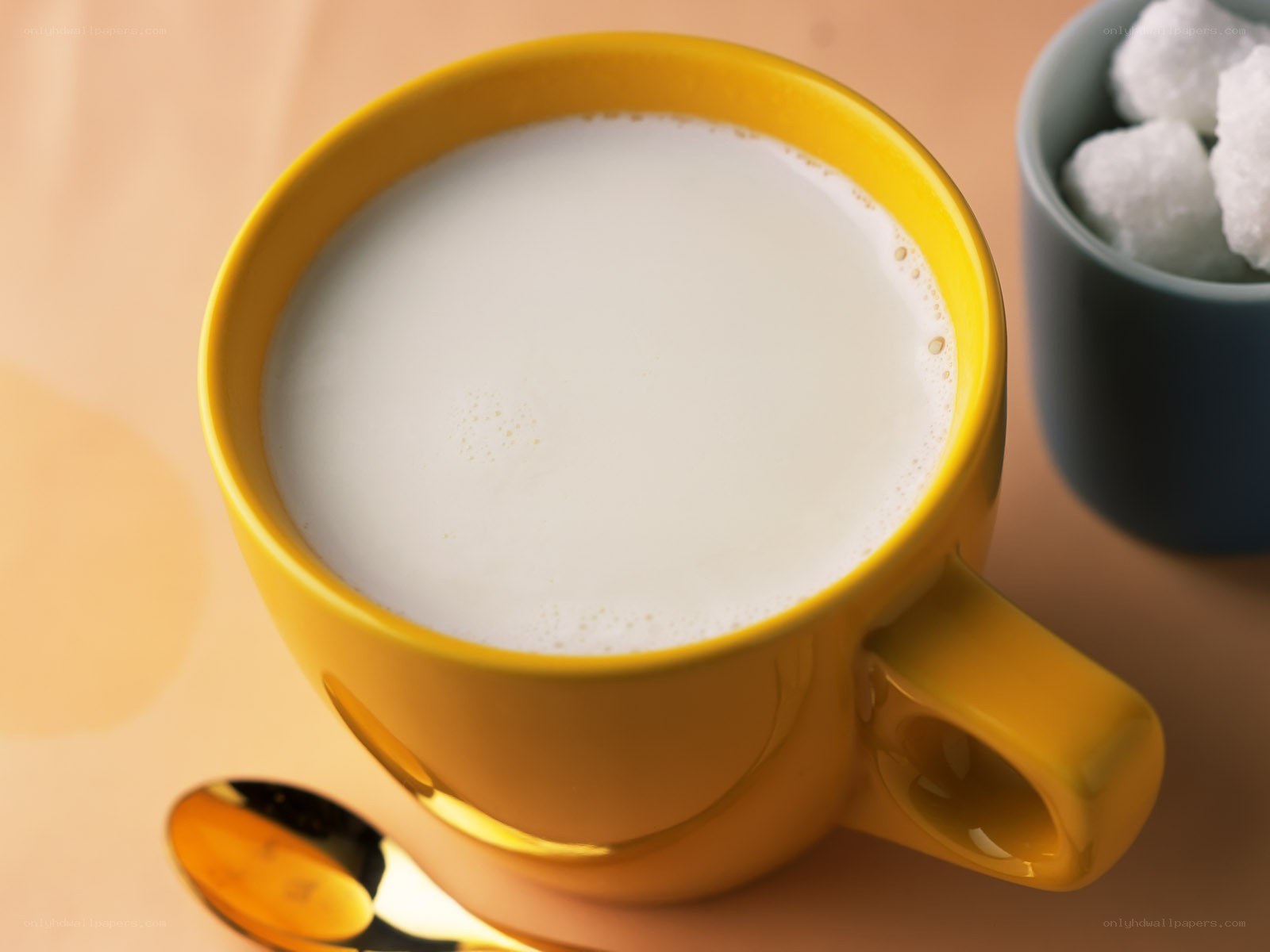 Yellow mug with milk