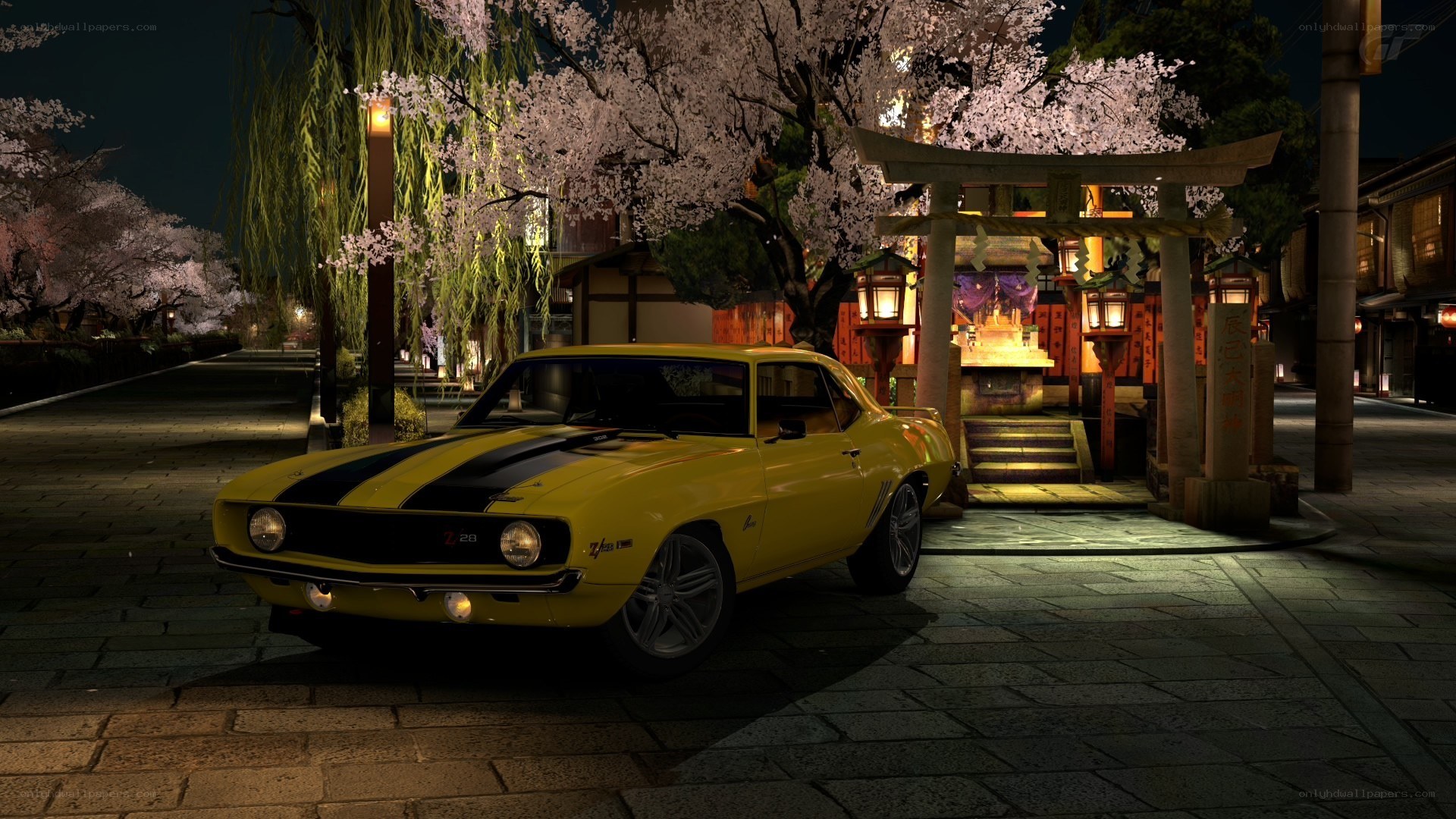 Yellow muscle car at night