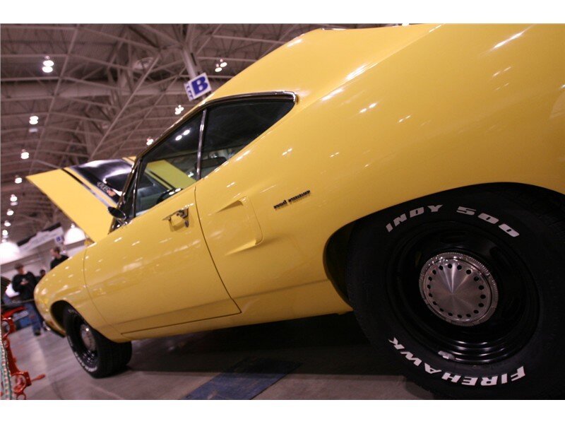 yellow muscle car at show