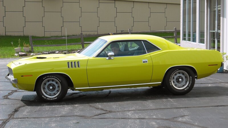 Yellow Muscle Car — Calm, Afternoon, Photograph, Building, Fence