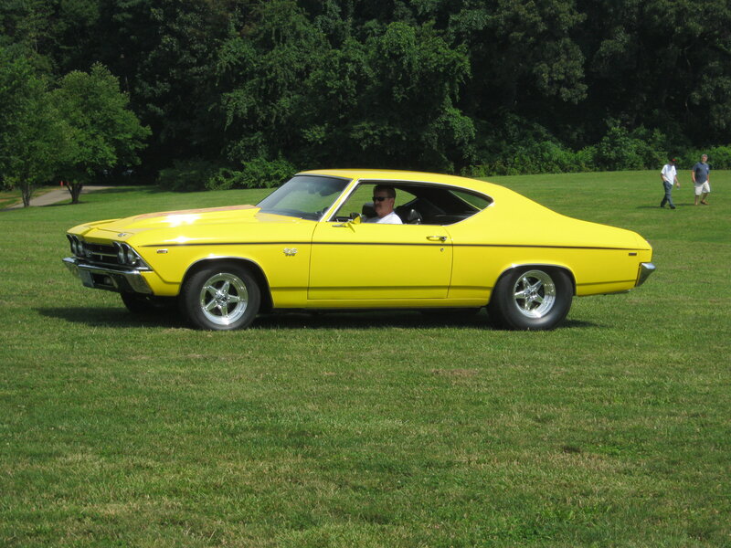 Yellow Muscle Car — Calm, Afternoon, Photograph, Man in Driver Seat