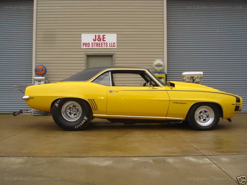 yellow muscle car in garage