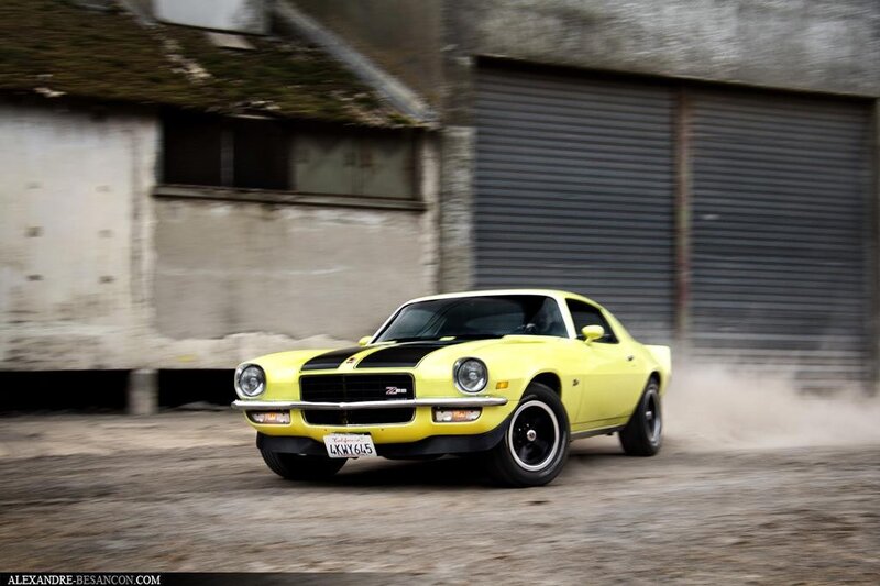 Yellow muscle car in motion