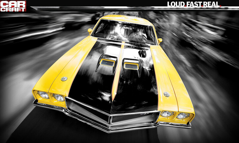 Yellow muscle car in motion