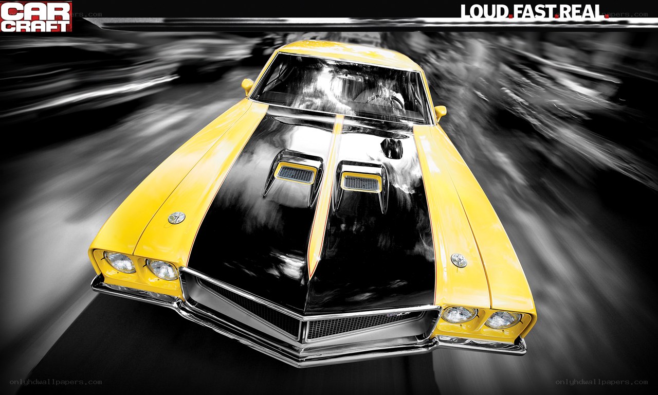 Yellow muscle car in motion