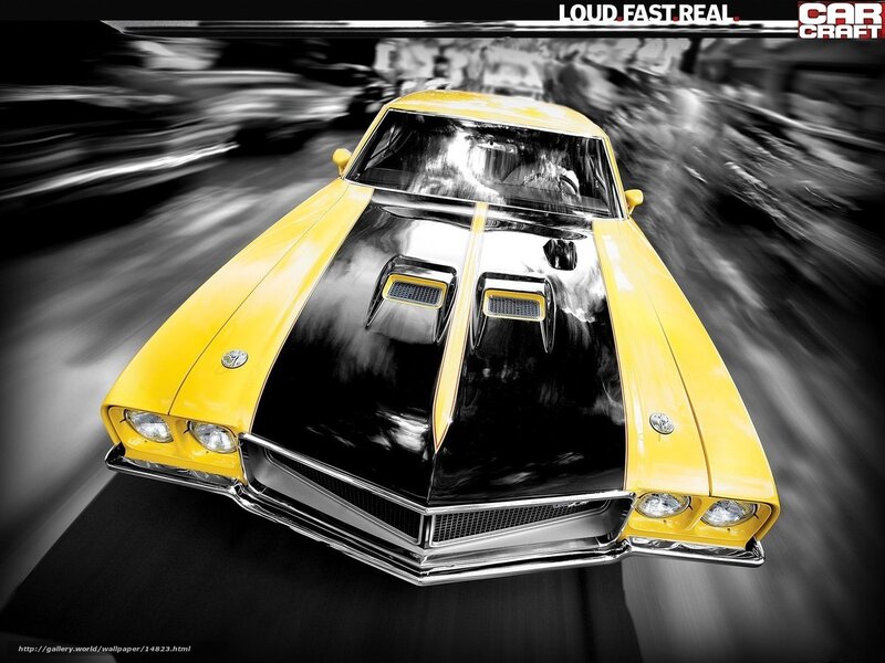 Yellow muscle car in motion