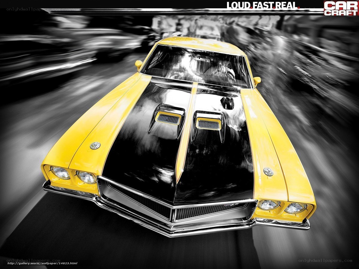 Yellow muscle car in motion