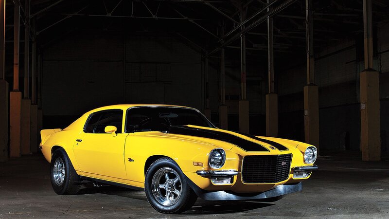 Yellow muscle car in warehouse