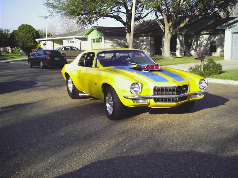 Yellow muscle car on street
