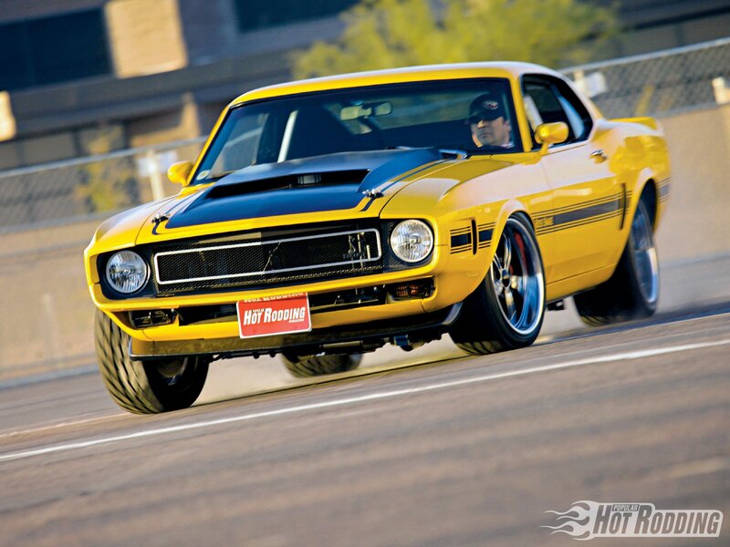 Yellow muscle car on track