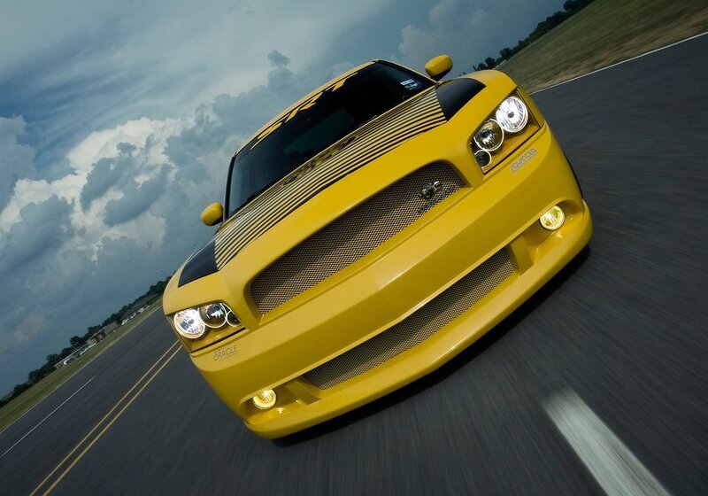 yellow muscle car on track